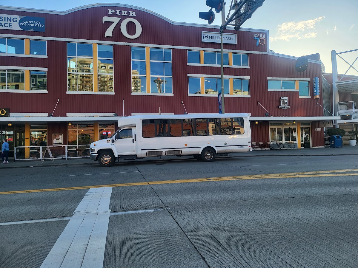 Seattle Party Limo party buses parked by a pier for cruise terminal group transportation